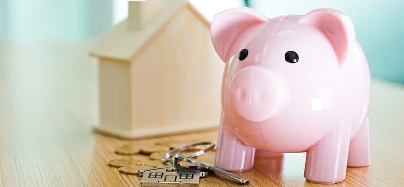 Tirelire en forme de cochon pour épargner dans un bien immobilier