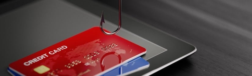 Concept d'hameçonnage de cartes de crédit. Crochet de pêche au-dessus des cartes de crédit. 